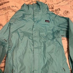 Blue Patagonia rain jacket